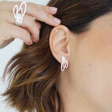 Load image into Gallery viewer, Handcrafted Mini Vera Stud Earrings in sterling silver, featuring a delicate design of seeds beginning to bloom, symbolizing new beginnings and growth, with a modern, elegant aesthetic.