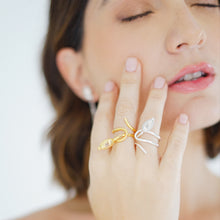 Load image into Gallery viewer, Handcrafted Seed Cocktail Ring in sterling silver and 18k gold plated, featuring an elegant, fluid design that wraps around the finger, culminating in a seed-shaped detail symbolizing growth and renewal