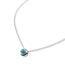 Load image into Gallery viewer, NATAL Birthstone Necklace for December with a medium-blue crystal inspired by Zircon, set in a 7mm sterling silver charm on a fine adjustable silver chain.
