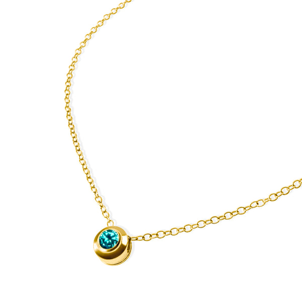 NATAL Birthstone Necklace for December with a medium-blue crystal inspired by Zircon, set in a 7mm 18K gold-plated charm on a fine adjustable gold-plated chain.