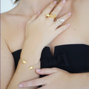 Seed Cuff Bracelet in Mixed Metal, handcrafted in sterling silver with an 18K gold-plated seed detail, featuring an open design symbolizing growth and new beginnings.
