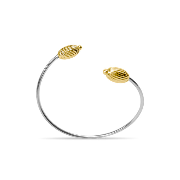 Seed Cuff Bracelet in Mixed Metal, handcrafted in sterling silver with an 18K gold-plated seed detail, featuring an open design symbolizing growth and new beginnings.