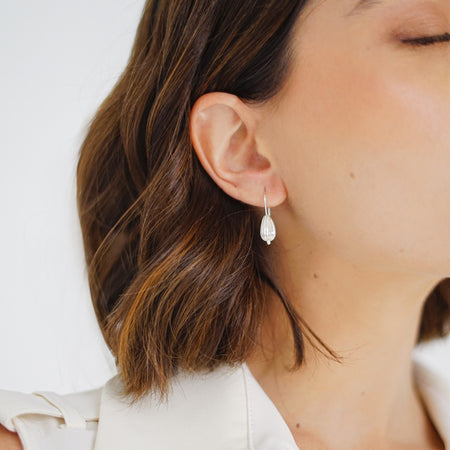 Seed Wire Earrings: Handcrafted earrings with a seed-inspired design, made from sterling silver.