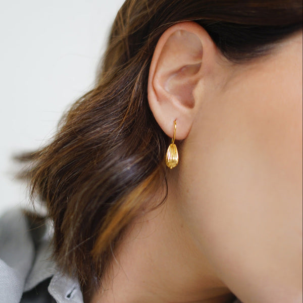 Seed Wire Earrings: Handcrafted earrings with a seed-inspired design, made from 18k gold-plated sterling silver.