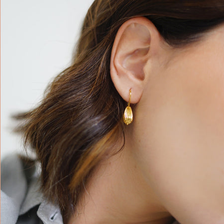 Seed Wire Earrings: Handcrafted earrings with a seed-inspired design, made from 18k gold-plated sterling silver.
