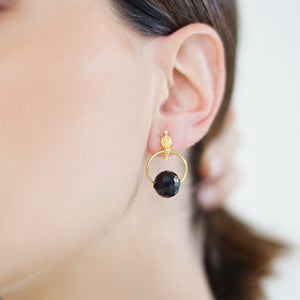 Handcrafted Allure Circle of Life Stud Earrings in 18k gold-plated metal with sparkling crystal beads in a modern circular design, available in different colors. Crystal in Black.