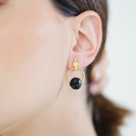 Handcrafted Allure Circle of Life Stud Earrings in 18k gold-plated metal with sparkling crystal beads in a modern circular design, available in different colors. Crystal in Black.