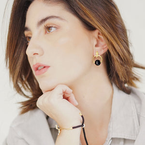 Handcrafted Allure Circle of Life Stud Earrings in 18k gold-plated metal with sparkling crystal beads in a modern circular design, available in different colors. Crystal in Black.