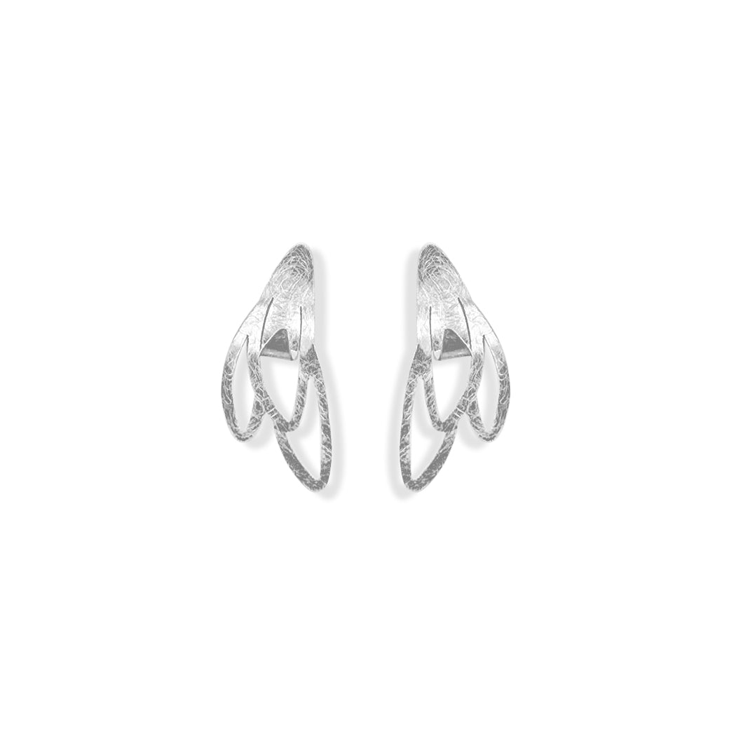 Handcrafted Mini Vera Stud Earrings in sterling silver, featuring a delicate design of seeds beginning to bloom, symbolizing new beginnings and growth, with a modern, elegant aesthetic.