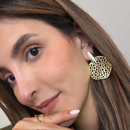 Model wearing Zaria handmade earrings — bold, organic design in 18k gold-plated over sterling silver.