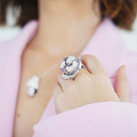 A handcrafted sterling silver cocktail ring featuring a singular amethyst stone with a unique cut, part of the exclusive One Piece Collection
