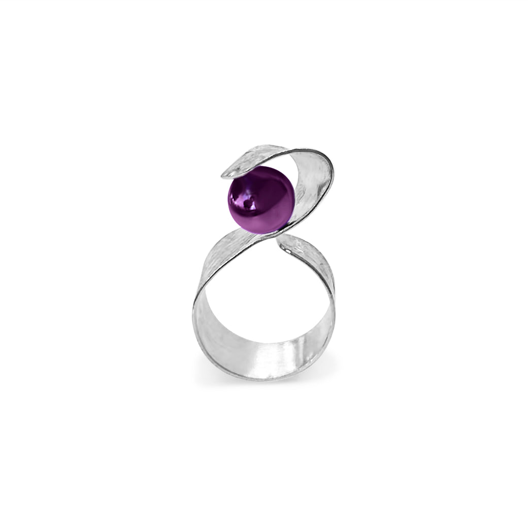 Handmade Maia Amethyst Ring featuring a radiant purple gemstone gracefully wrapped in sterling silver lines, creating a modern and sophisticated design.